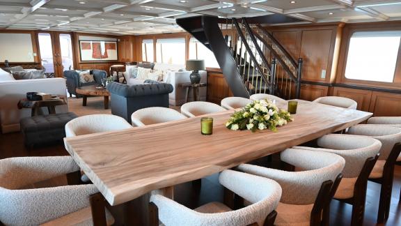 Kokomo Nights features a large dining table and spacious saloon designed for social gatherings at sea.