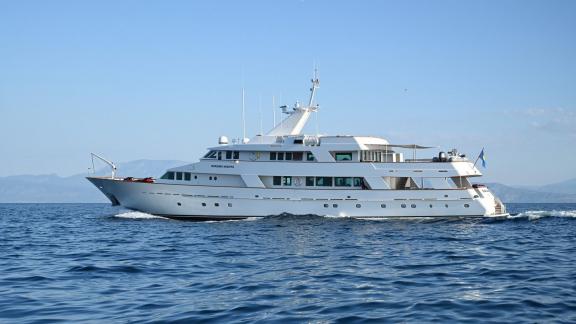 Kokomo Nights cruises off the coast of Athens, showcasing elegant lines and an impressive long profile.