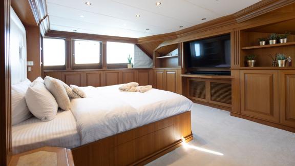 Kokomo Nights features a spacious master suite with elegant wood finishes and exceptional onboard comfort.