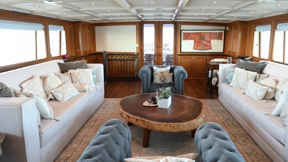 Kokomo Nights features spacious lounge seating and a warm atmosphere for comfortable onboard living in Athens.
