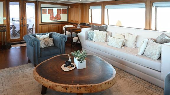 Kokomo Nights features spacious sofas and elegant décor, creating an inviting onboard lounge atmosphere.