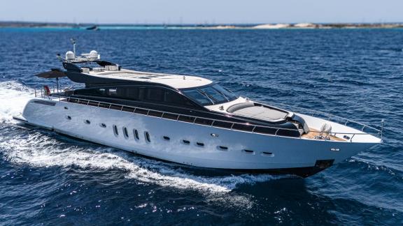 The motor yacht La Romana impresses with its sleek design as it cruises swiftly through open waters.