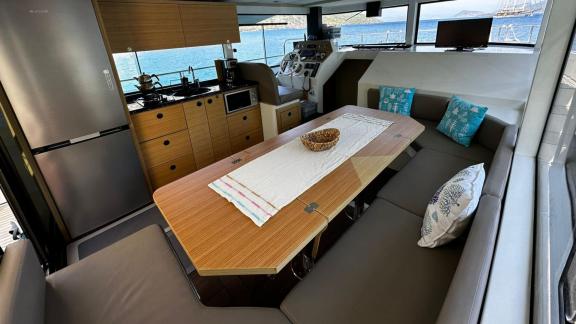 Elegant dining area and fully equipped kitchen with sea view on the yacht Labarna.