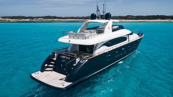 The aft deck of Lady KC offers the perfect setting for a peaceful retreat in turquoise waters.