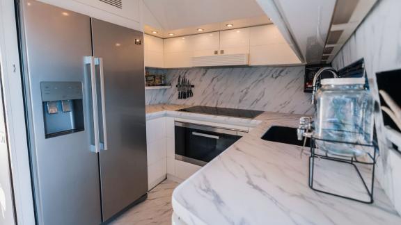 Among Ibiza luxury yacht charter options, Lady KC is seen with a fully equipped modern galley.