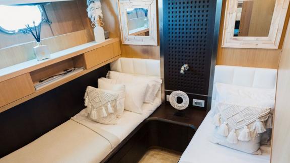 Among Ibiza daily yacht charter options, Lady KC is seen with a guest cabin featuring twin single beds.