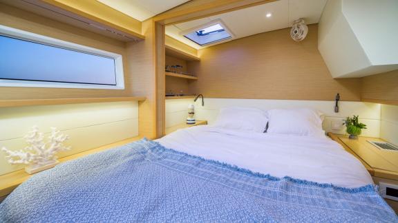 Largo Winch features a bright double guest cabin, offering a comfortable catamaran charter experience in Mykonos.