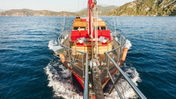 Gulet Le Rouge sails gracefully through calm waters, offering an unparalleled view from the front.