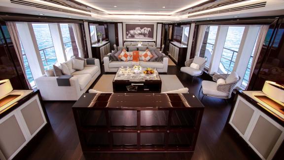 The spacious salon of the Legende motor yacht combines style and comfort for an exceptional Dubai yacht rental experienc