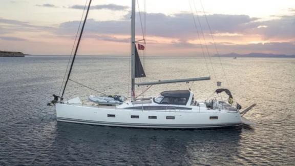 The Life Time sailing yacht sails on calm seas at sunset, offering a peaceful voyage.