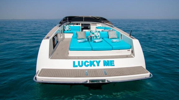 The rear view of Lucky Me motor yacht, a perfect choice for Dubai yacht rental services.