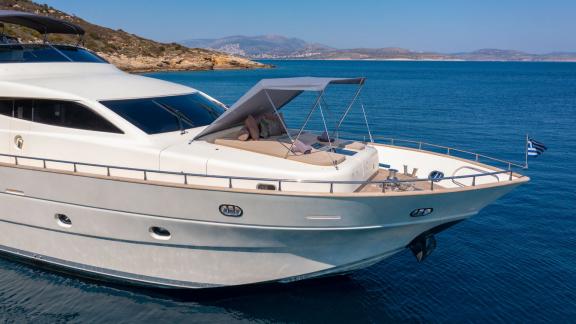 Comfortable seating area with shade on the front deck of the Miraval yacht.