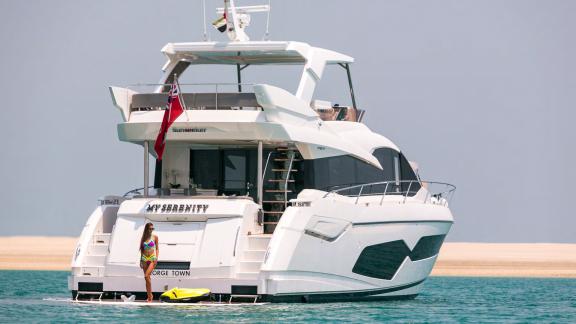 The aft deck of the yacht My Serenity offers a perfect spot for relaxing on the water.