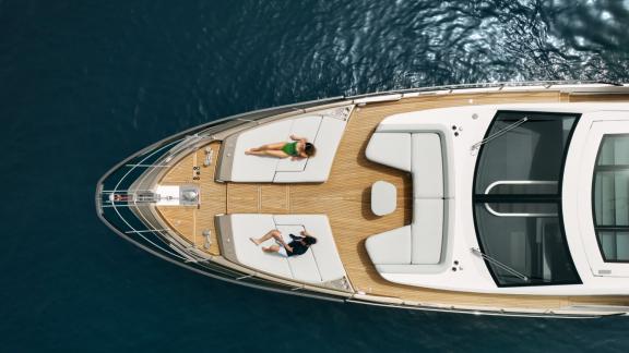 Enjoy luxury yacht charter on the Myne motor yacht in Split with sun loungers on the foredeck for ultimate relaxation.