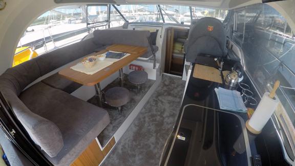 Interior living area of motor yacht North Star with spacious seating and kitchen.