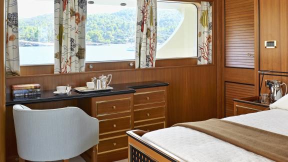 Northwind 2 features a guest cabin with sea view windows and a practical desk for comfortable onboard stays.