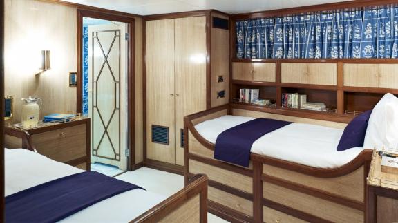 Northwind 2 features a twin guest cabin with generous storage space and a comfortable twin bed layout.
