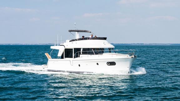 The motor yacht Ocean Dreamer cruising on the open sea.