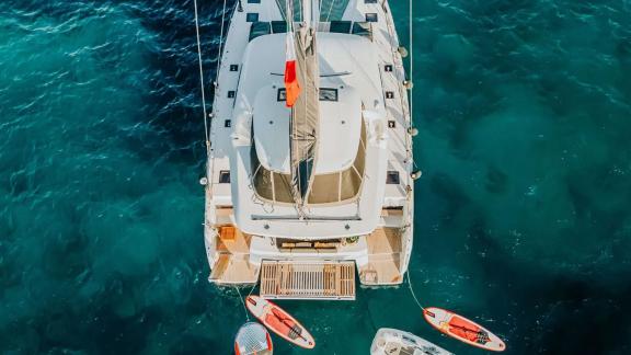 The Oneida 2 catamaran seen from above with water toys at the rear.