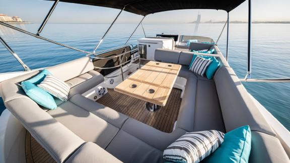 The spacious deck of the Outlaw yacht offers a unique open-air experience for Dubai yacht rentals.