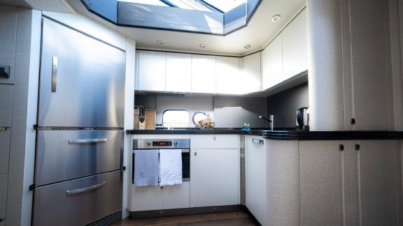 The spacious and modern kitchen of Outlaw makes it a perfect choice for yacht rental in Dubai.