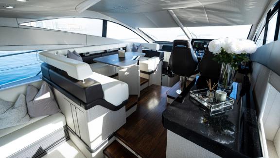 Stylish and comfortable seating area on the Outlaw yacht, perfect for luxury yacht rentals in Dubai.