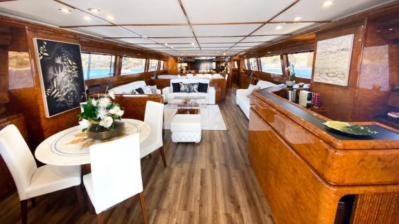 The spacious salon of Paula 3 yacht is furnished with comfortable seating areas and stylish details.