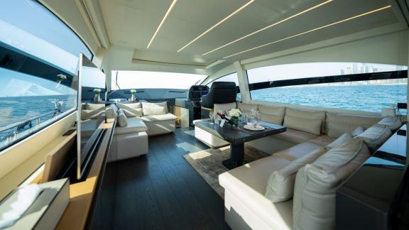 The stylish and modern saloon of Pershing 70 makes your Dubai motor yacht rental experience unforgettable.