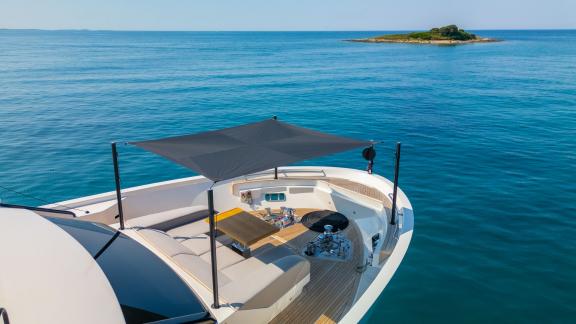 Relax aboard Primus motor yacht near Split with Adriatic views and shaded bow seating.