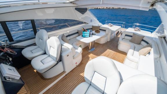 The captain seats, dining table and lounge areas of Princess Juliet are seen while in Ibiza.