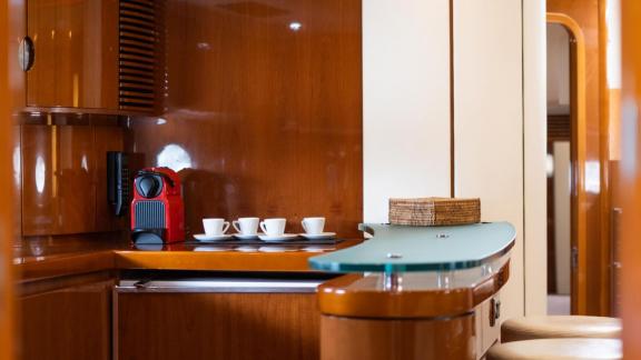 The elegant bar area of Princess Juliet features an espresso machine and a convenient service counter.