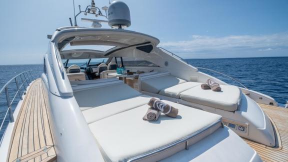 The spacious sun pads and cockpit area of Princess Juliet are seen while cruising in Ibiza.