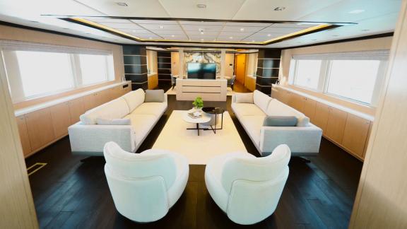 The spacious and modern interior lounge of Princess Melda offers comfortable seating areas.