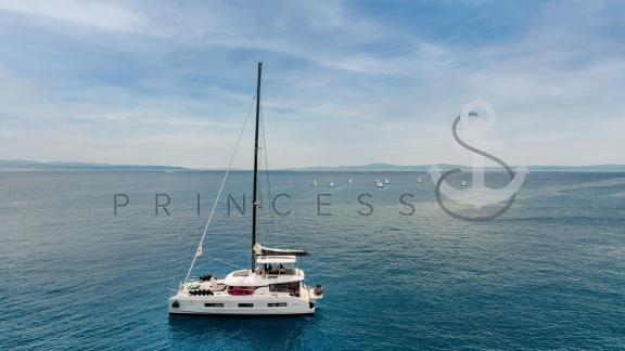 Catamaran Princess S sailing on the calm Adriatic Sea under blue skies