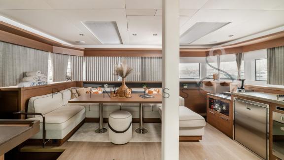 Stylish and modern salon area on the catamaran Princess S with a cozy seating area