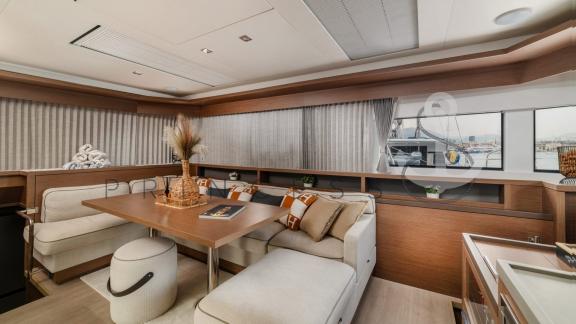 Elegant seating area in the modern salon of the catamaran Princess S with stylish decor