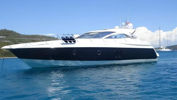 The motor yacht Sabijac elegantly stands on the blue waters of the open sea.