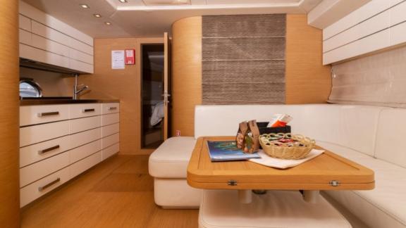 The interior of motor yacht Sabijac features a dining area and a modern kitchen.