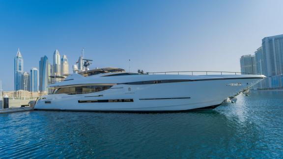 The luxury yacht Saffuriya is docked at the harbor with a modern city backdrop.