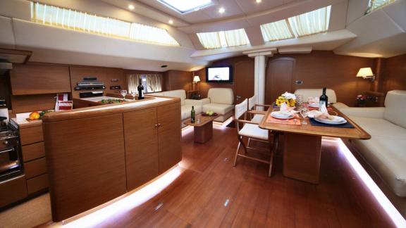 The interior of the luxury yacht Shooting Star in Greece features comfortable seating areas and a stylish dining table.