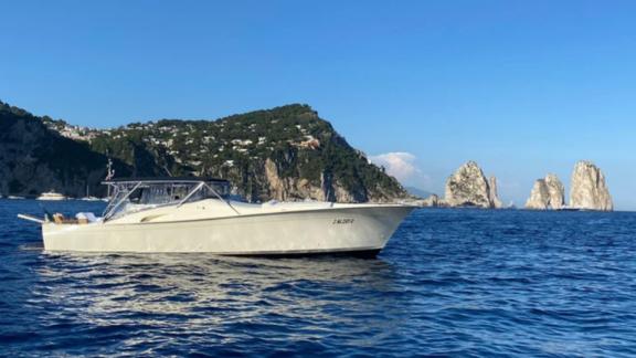 Skins is a top choice for motor yacht rental in Naples, combining luxury and comfort against Capri's stunning scenery.