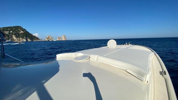 With a Naples motor yacht rental, you can relax on Skins' deck and enjoy the stunning view of Capri.