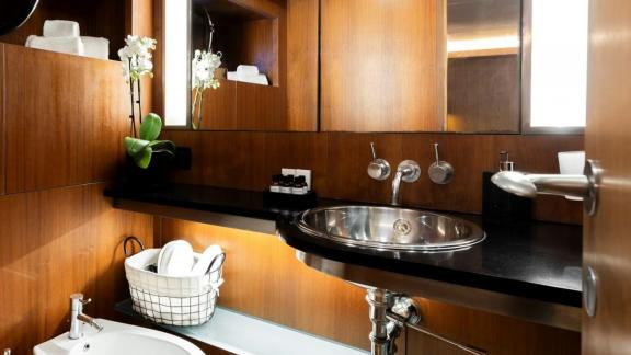 Among motor yacht rental options in Athens Sounion II bathroom with sink and mirror offers a stylish onboard space.