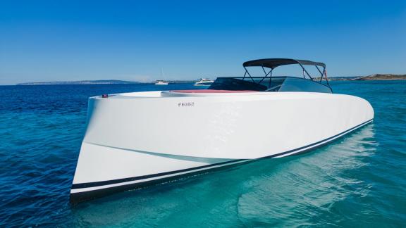 The Tequila motor yacht dazzles with its sleek and modern lines, cruising over crystal-clear waters.