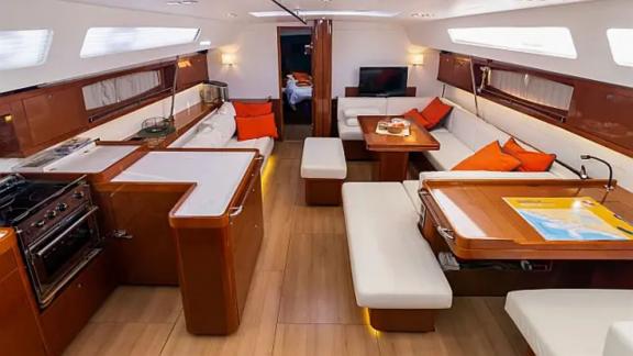 The modern saloon of the Tourbillon sailing yacht features stylish decor and a comfortable seating area.