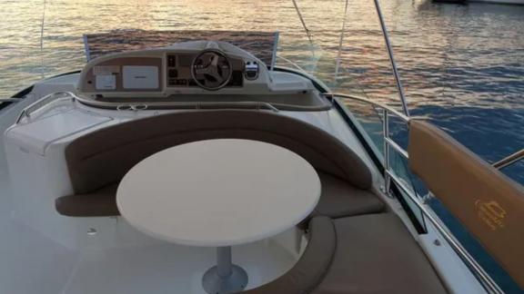 Comfortable seating area of the motor yacht Unplugged with sea view.