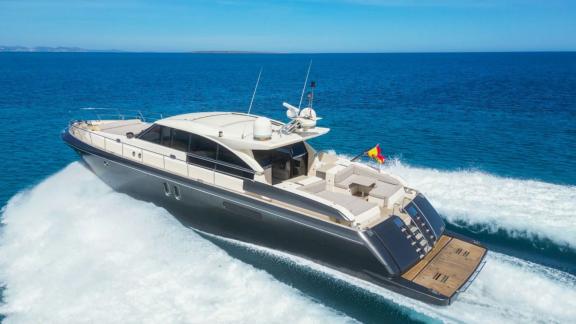 Motor yacht Vintage cruising swiftly, showcasing a spacious aft deck and modern design.