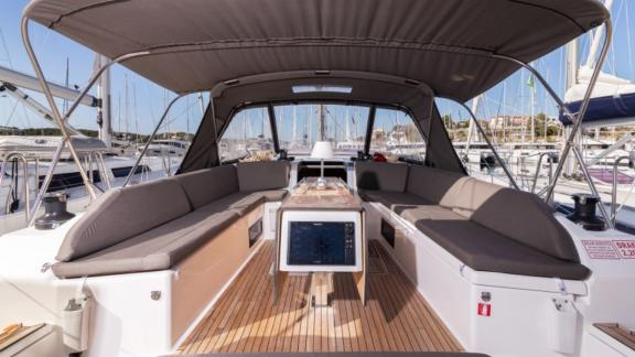 Spacious and comfortable aft deck seating area of the Vita yacht.