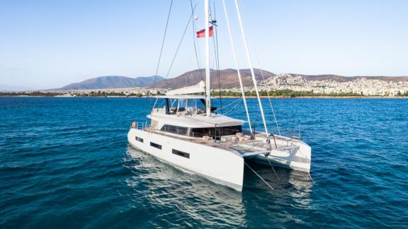 White Caps catamaran stands out with its elegant design and spacious areas on the open sea.