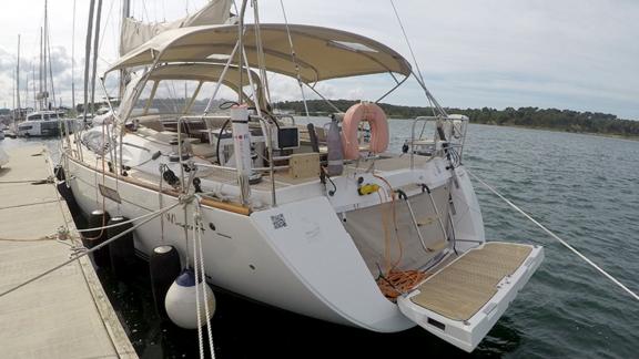 The aft deck of Whyknot yacht is securely docked at the pier.